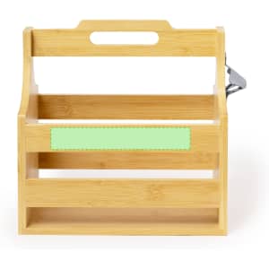 A drink bottle holder made of bamboo, featuring a light green accent and a handle for easy carrying.