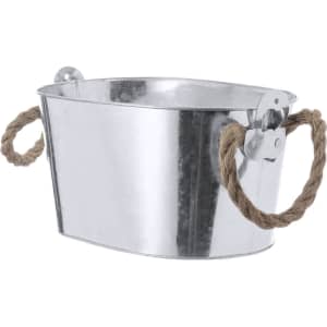 A metallic ice bucket with a shiny finish and rope handles, ideal for outdoor gatherings.