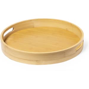 A round bamboo tray with smooth edges and two side handles, showcasing a natural wood finish.