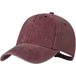 A burgundy cap featuring a soft texture and an adjustable strap at the back, with a logo on the front.