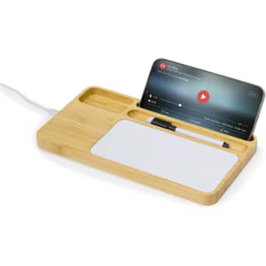 A bamboo wireless charger with a phone holder, pen slot, and a small compartment for accessories.