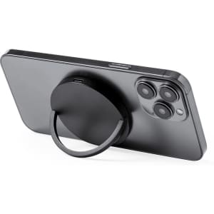 A wireless charger with a sleek black design, featuring a circular base and a foldable ring stand for easy grip.