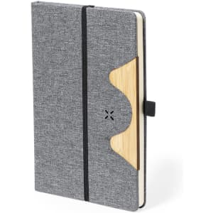 A grey notepad with a wooden accent, featuring an elastic closure and a simple design. It has a branding logo.