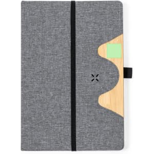 A grey notepad with a bamboo accent, featuring a black elastic band and a sticky note holder.