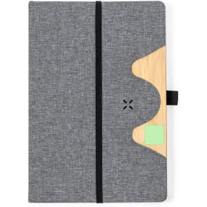 A grey notepad with a bamboo accent and a secure elastic band closure. It features a logo on the cover.