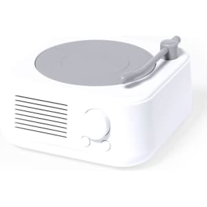 A compact white speaker with a grey turntable design, featuring a control knob and speaker grille.