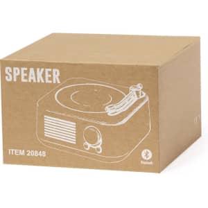 A brown cardboard box containing a Bluetooth speaker design with a turntable illustration.