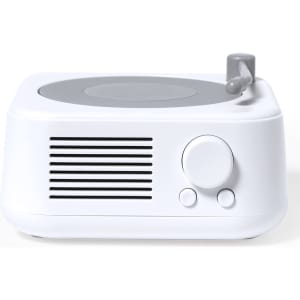 A compact white speaker featuring a grey top, volume knob, and vented side for sound. It includes a logo on the surface.