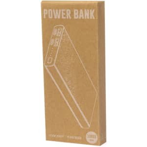A power bank in a cardboard box, featuring a sleek design and available in silver. It has a logo and multiple USB ports.