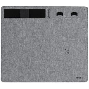 A grey mousepad with a textured surface and sections for wireless charging, featuring some branding.