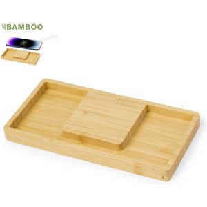 A bamboo wireless charger with two compartments for organising devices and accessories, featuring a small logo.