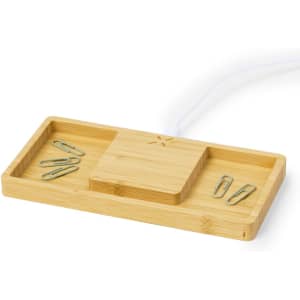 A bamboo wireless charger with sections for organisation, featuring paperclips. The design includes a logo.