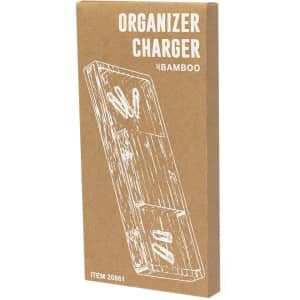 A bamboo organiser charger in a textured brown box. The package features compartments for accessories and includes a logo.