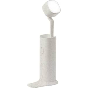 A grey Olan Holder Lamp with a sleek design and an integrated light on top, featuring a branding logo.