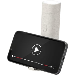 A grey Olan Holder Lamp with a smartphone propped up, displaying a video play screen. The product features a logo.