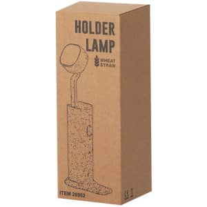 A boxed lamp with a holder design, made from wheat straw, featuring a speckled texture. It includes a logo.