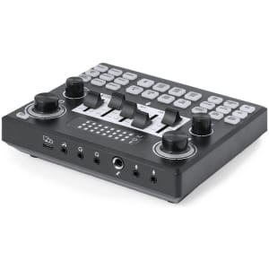 A black audio mixer with multiple knobs, buttons, and ports for connectivity. It features a logo on the front.