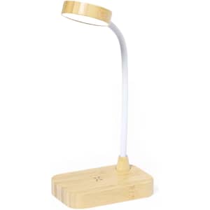 A wireless charger lamp with a wooden base and a flexible white neck, featuring a circular lamp head.