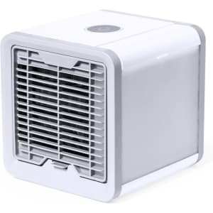 A compact white mini air conditioner with a grid front and a power button on top. Features a sleek design.