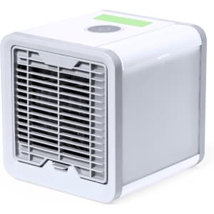A compact mini air conditioner in white and grey, featuring a front vent and a control button on top.