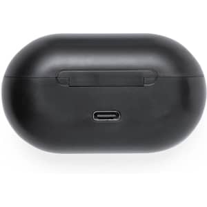 A black charging case for earphones with a central USB-C port and a sleek, rounded design.