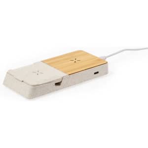 A wireless charger with a bamboo surface and a textured grey base, featuring a visible charging port.