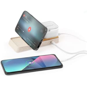 A wireless charger with a sleek design, featuring a white base and a smartphone displaying video content.