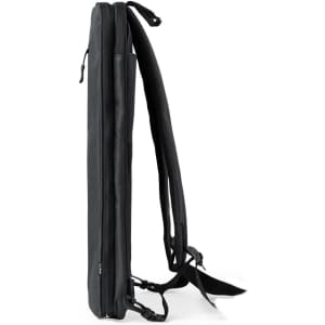 A sleek, black backpack with padded straps and a slim profile, featuring a logo. Ideal for minimalistic style.