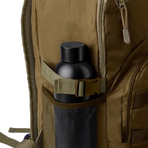 A brown backpack featuring a side pocket containing a black drink bottle, with a mesh design and adjustable strap.