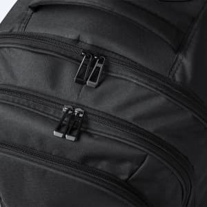 A black wheeled backpack featuring multiple zippered compartments and a sleek design. It has a logo on the surface.