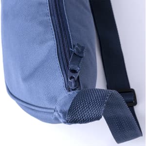 A blue shoulder bag with a zippered compartment and an adjustable strap, featuring a textured handle.