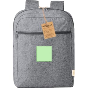 A grey backpack with two straps, featuring a front zip pocket and a square green panel. It has a tag attached.