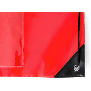 A red drawstring bag featuring a black reinforced corner and a grommet for securing the drawstring.
