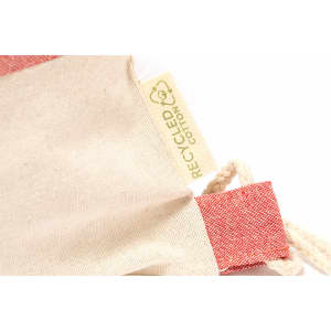 A drawstring bag made from recycled cotton, featuring a red and natural colour scheme with a branding label.