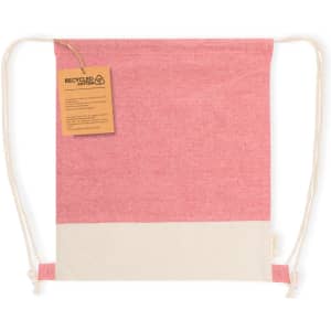 A pink and cream drawstring bag with a tag, featuring a recycled material design and a logo.