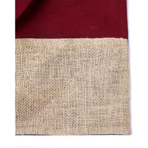 A maroon tote bag featuring a textured burlap bottom and a simple design, complete with a logo.