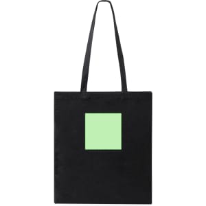 A black tote bag with a green square on the front and two long handles. Features branding.