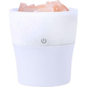 A white aromatic diffuser with a textured top and rock salt inside, featuring a power button on the base.