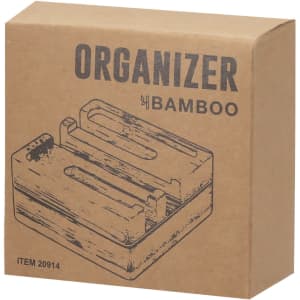 A bamboo organiser in a carton box, featuring a simplistic design with multiple slots for items. It has a branding logo.