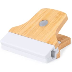 A bamboo-handled clip with a white plastic base, designed for office use and organisation.