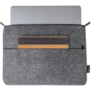 A grey laptop pouch with a silver laptop and a notebook partially visible inside. It features a zipper and a branding label.