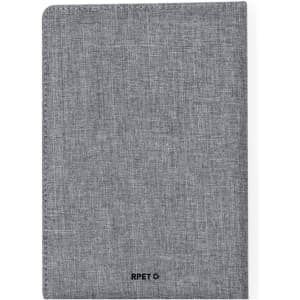 A grey notepad with a textured finish and a logo at the bottom. It features a durable cover.