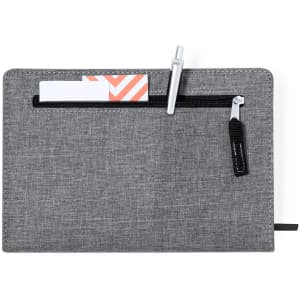 A grey notepad with a zippered pocket, a pen holder, and a card slot. Features a simple, modern design.