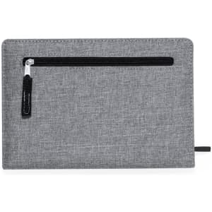 A grey notepad with a zippered pocket and a pen holder, featuring a subtle fabric texture.