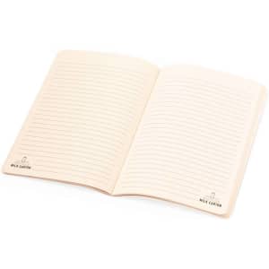 An open Agnila Notebook featuring blank lined pages with a cream interior and a logo in one corner.
