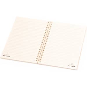 A spiral-bound notebook with lined pages and a beige cover, featuring branding in one corner.