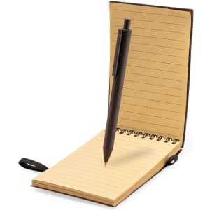 A brown notebook with lined pages and a black pen resting on it. The notebook is spiral-bound and closed.