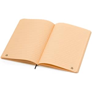 An opened peach-coloured notepad with lined pages and a logo on the bottom corner.