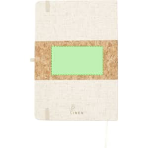 A notepad with a linen cover and cork accent, featuring a green rectangular area and an elastic closure.