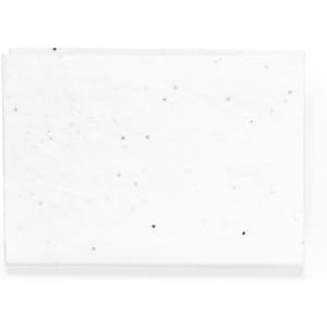 A white sticky notepad with a textured surface and small black specks throughout. It features a logo in the corner.
